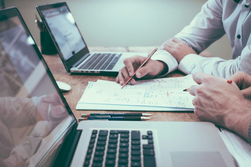 Route planning documents and logistics coordination at a desk