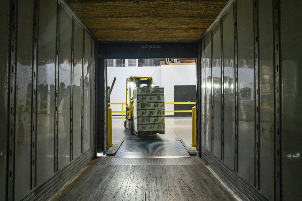 Forklift coordinating cargo movement in a warehouse