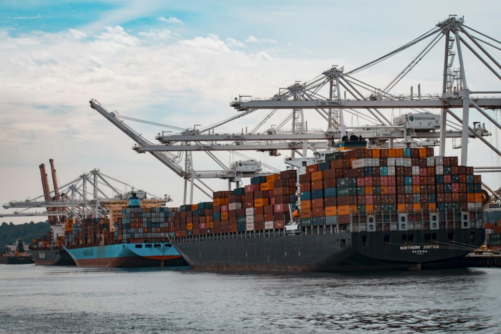 Shipping containers being moved for commercial transport