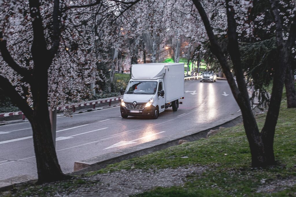 White delivery van on a local road